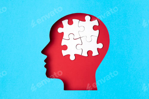 Preview: Papercut head with jigsaw puzzle pieces inside. Mental health problems, psychology, memory, logic