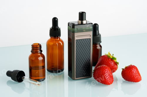 Preview: Electronic cigarette liquid with strawberry flavor on white background