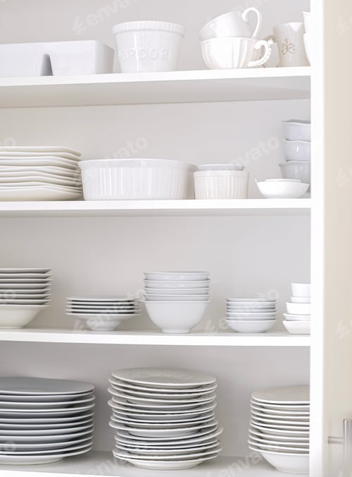 Preview: An open kitchen cupboard with organized tidy white plates, dishes and cups