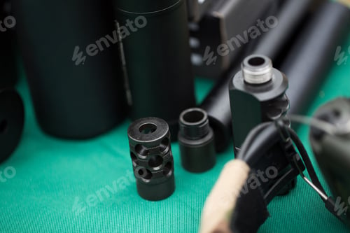 Preview: silencers for weapons are on the green table