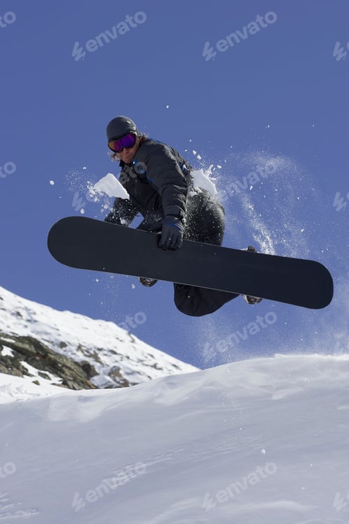 Preview: Snowboarder doing tricks on slope