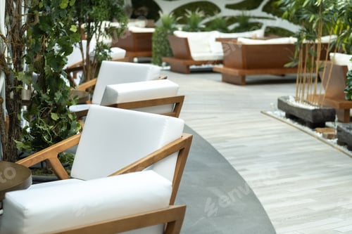 Preview: Cropped shot of a stylish light chair in the interior of the hall