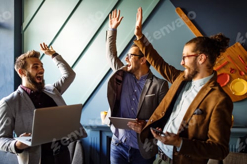Preview: Happy successful business man giving a high fives gesture as cheer their success