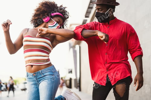 Preview: Afro American friends wearing face protective mask doing new social distance