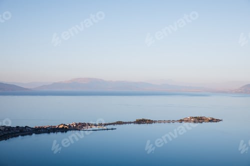Preview: aerial view of majestic landscape with calm blue water and mountains in fog, egirdir, turkey