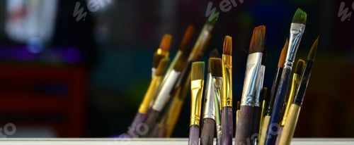 Preview: Art paint brushes in cup are located in the children's entertainment hall at the mirror