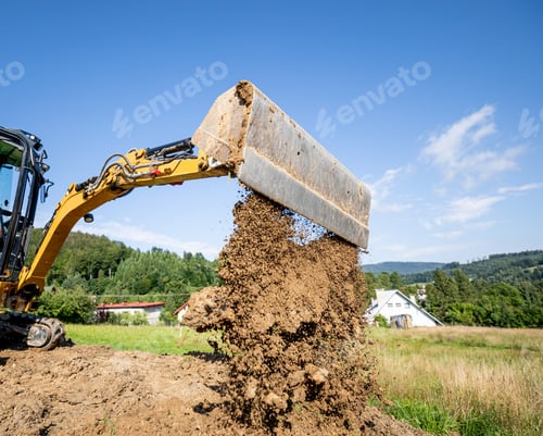 Preview: Mini excavator digging preparing ground under home garden
