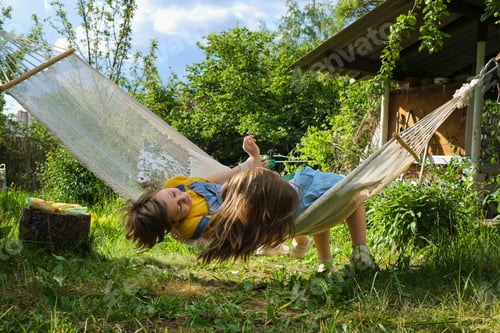 Preview: Children bask in happiness harmony, sharing laughs on a backyard hammock, illustrating the serene