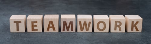 Preview: The word teamwork is standing on wooden cubes