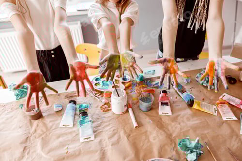 Preview: Children demonstrating their palms painted with watercolor