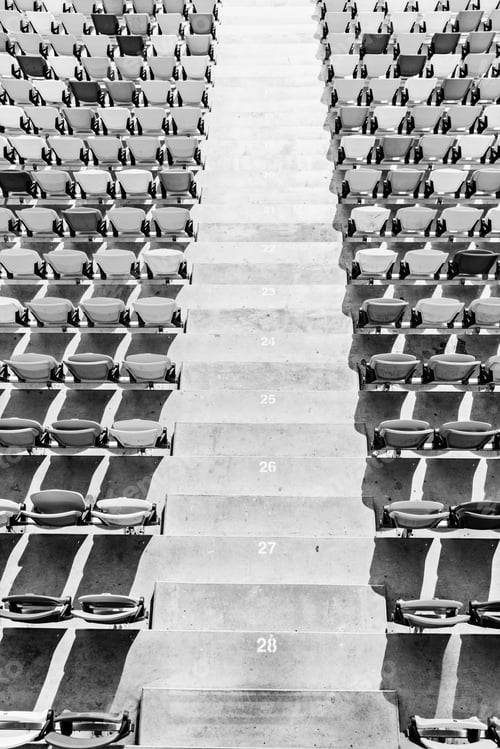 Preview: rows of stadium seats and stadium stairs, black and white