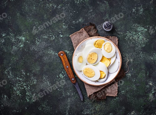 Preview: Boiled sliced chicken eggs on plate