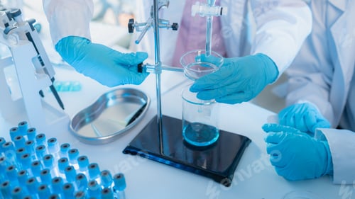 Preview: Two female scientists in white lab coats working together in a bright laboratory with microscopes