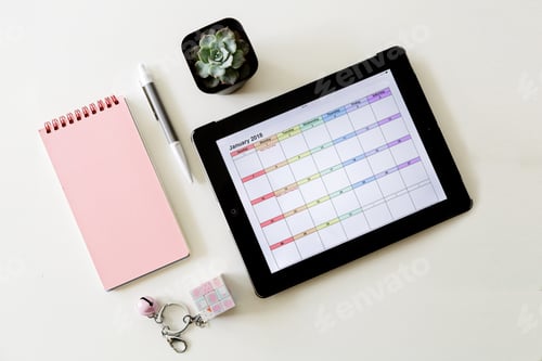 Preview: Top view of tablet and office supplies on white background