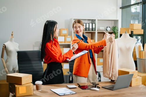 Preview: Two professional young Asia cheerful lady fashion designer teamwork with casual site