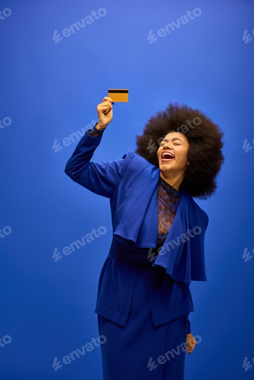 Preview: Modern Elegance: Woman in Blue Suit With Credit Card
