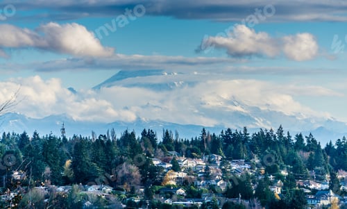 Preview: Puffy Clouds Cover Mount Rainier In Washington State.