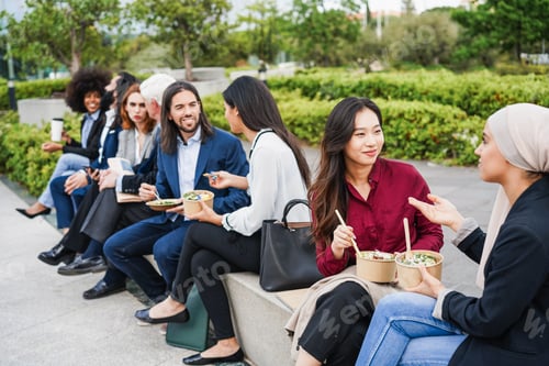Preview: Business people doing lunch break with healthy food outdoor from office building