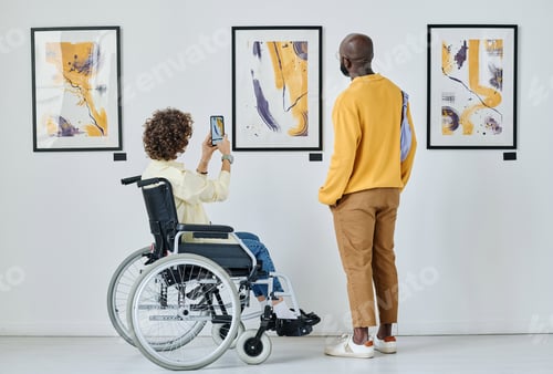 Preview: Woman enjoying modern art at gallery