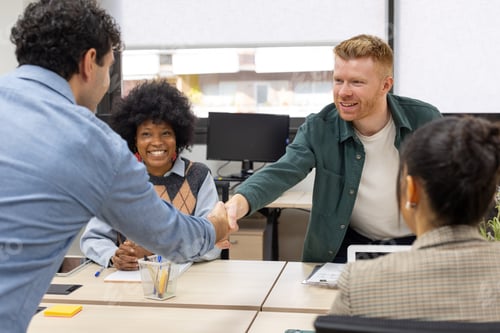 Preview: Business people shaking hands confirming a deal