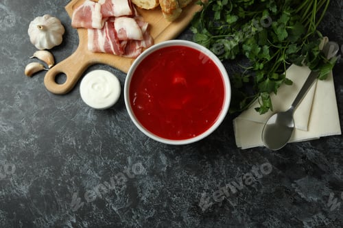 Preview: Concept of tasty eating with borscht on black smokey background