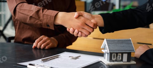 Preview: Real estate agents shaking hands To congratulate buyers after giving buyers a purchase contract, a c