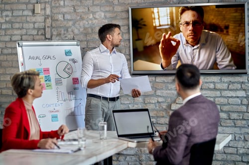 Preview: Business team having video conference with their CEO in the office.
