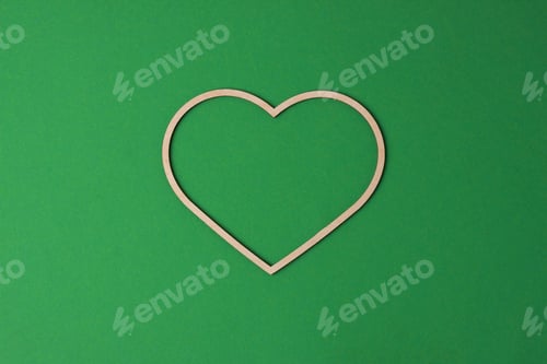 Preview: Cosmetic background with a wooden heart on green. Flat lay, copy space