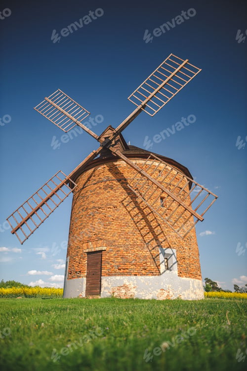 Preview: Vertical shot of an old brick windmill in the fields of Moravia, Czech Republic