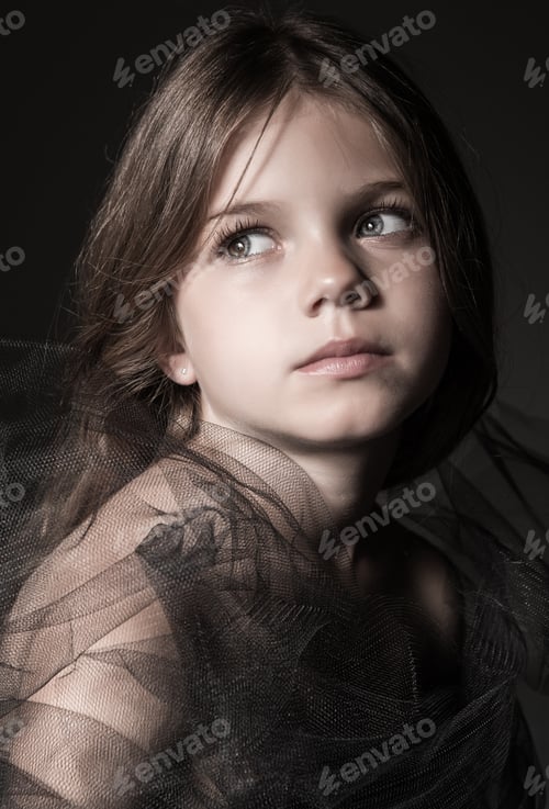 Girl Posing with Black Tulle Fabric in Studio