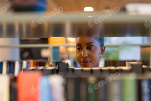 Preview: Student searching books in library