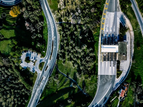 Preview: Aerial view of highway, expressway and motorway with a toll payment point in Italy