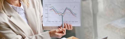 Preview: Close up of businesswoman making online videoconference and demonstrate financial graphs