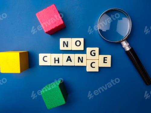 Preview: Top view colored block and magnifying glass with text NO CHANGE OR CHANCE on blue background