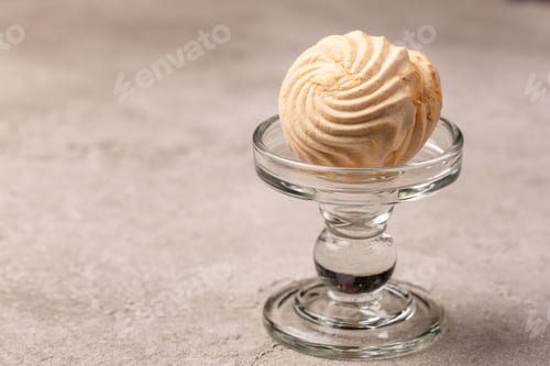 Preview: Vanilla banana marshmallow, Russian dessert, on a glass stand, open space