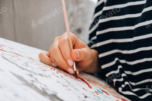 Preview: Painting on canvas by numbers and numbered jars of paint. Woman draws with a brush painting by numbe