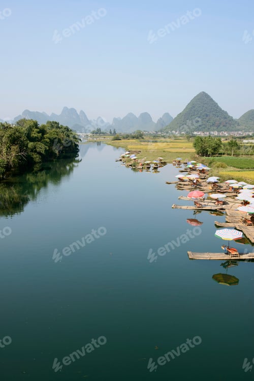 Preview: Scenic view of Boats docked in still river