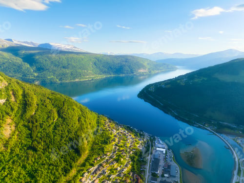 Preview: High mountains and reflections on the surface of the water. Vacation and travel in summer Norway.