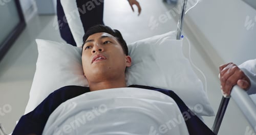 Preview: Emergency, bed and man rush in hospital for medical surgery with team of doctors in clinic corridor