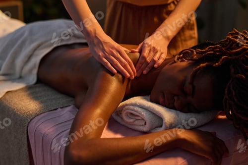 Preview: Relaxed Woman Enjoying Massaging in Shoulder Area