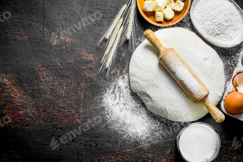 Preview: Dough background. Dough with butter, milk and flour in bowls.
