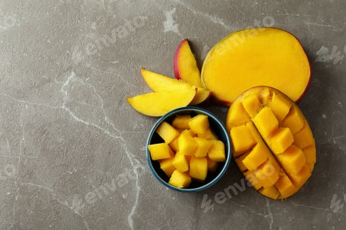 Preview: Tasty ripe mango fruit on gray textured background