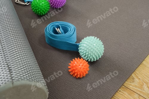 Preview: Yoga accessories in gym or sport studio, yoga mat, massage balls and yoga belt
