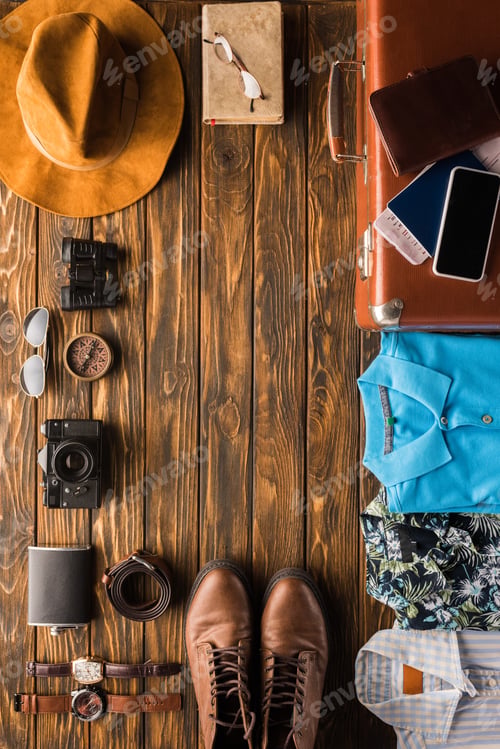 Preview: frame made of vintage suitcase with baggage for travel on wooden surface