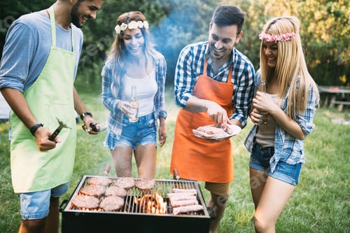 Preview: Friends spending time in nature and having barbecue