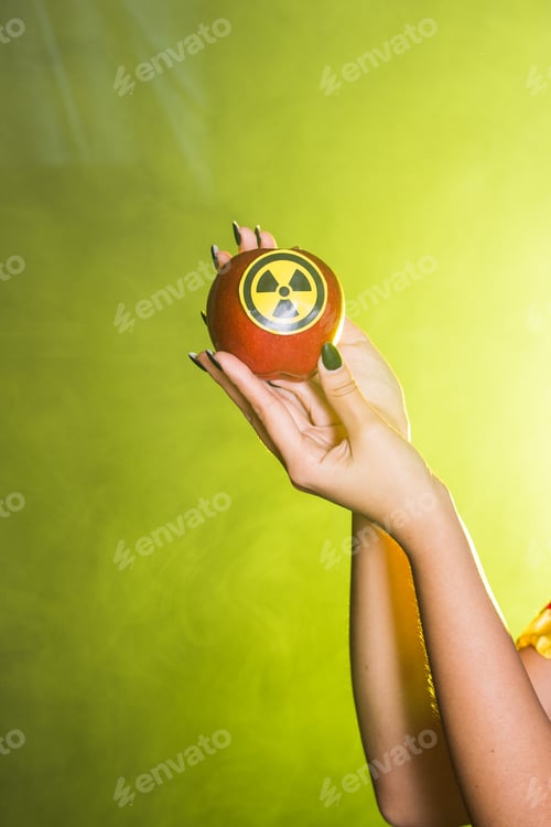 Preview: Woman dressed as fairytale character holds Radioactive atomic nuclear ionizing radiation danger