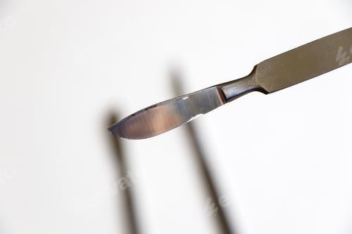 Preview: Surgery blade on sterile white background
