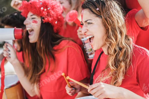 Preview: Crazy football supporters playing drums and screaming while supporting their team