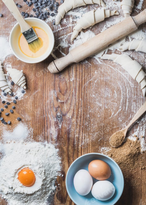 Preview: Baking ingredients for cooking croissants over wooden background, copy space