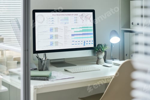 Preview: Modern Office Desk Displaying Statistical Charts and Analyzing Data Trends